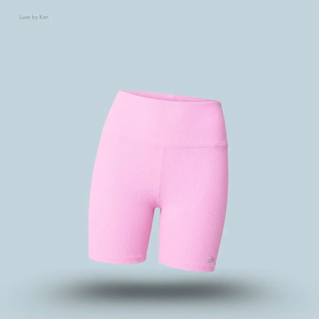 Alo 5 inch Seamless Ribbed Favorite Short in Candy Heart Pink, flat lay on light blue background