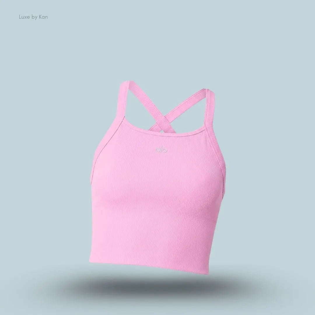 Alo Seamless Ribbed Favorite Bra Tank in Candy Heart Pink, flat lay on light blue background