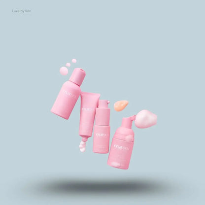  Kylie Skin by Kylie Jenner 4-Piece Mini Skincare Set with swatches on blue background — LBK