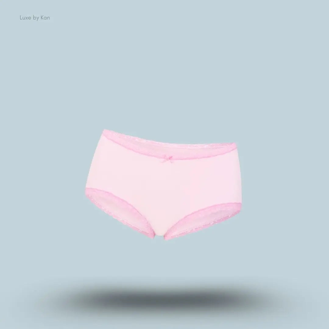 SKIMS Lightweight Cotton Lace Boy Short in Cherry Blossom, flat lay on light blue background