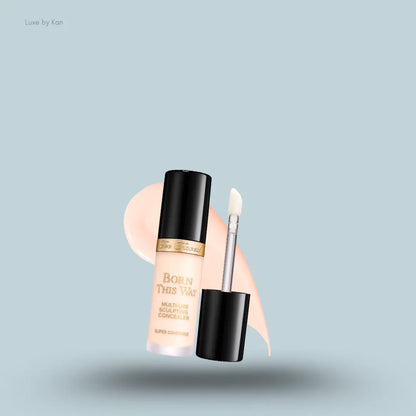 Too Faced Born This Way Super Coverage Concealer in Cloud, on a light blue background