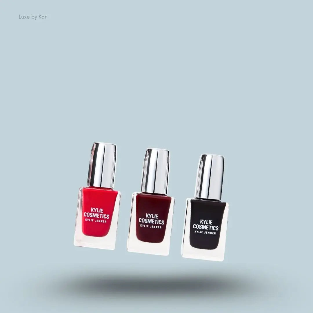 Kylie Cosmetics Holiday Collection Nail Lacquer Trio bottles and swatch on blue background — LBK