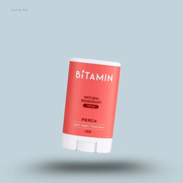 Bitamin Peach Teens Natural Deodorant 15g bottle on blue background — Luxe by Kan India
