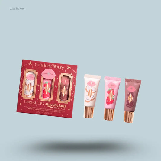 charlotte tilbury lip mini trio with packaging on blue background.