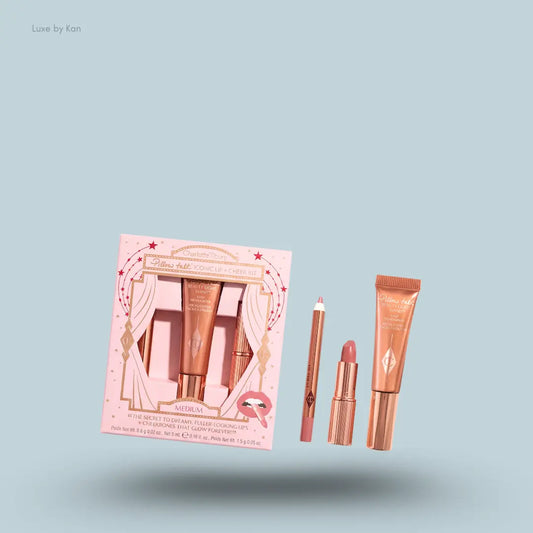 Charlotte Tilbury Pillow Talk Iconic Lip + Cheek Kit three products with packaging on blue background