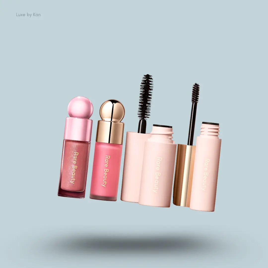 Rare Beauty Bestselling Faves 4-Piece Set Soft Pinch blush, lip gloss, brow gel and mascara on blue background