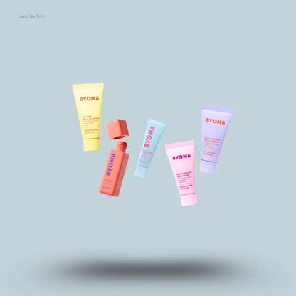 BYOMA The Barrier Boosting Lab Kit five skincare products on a blue background