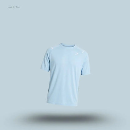 Gymshark Arrival Contrast T-Shirt in light blue displayed on a blue background with contrast shoulder piping and short sleeves