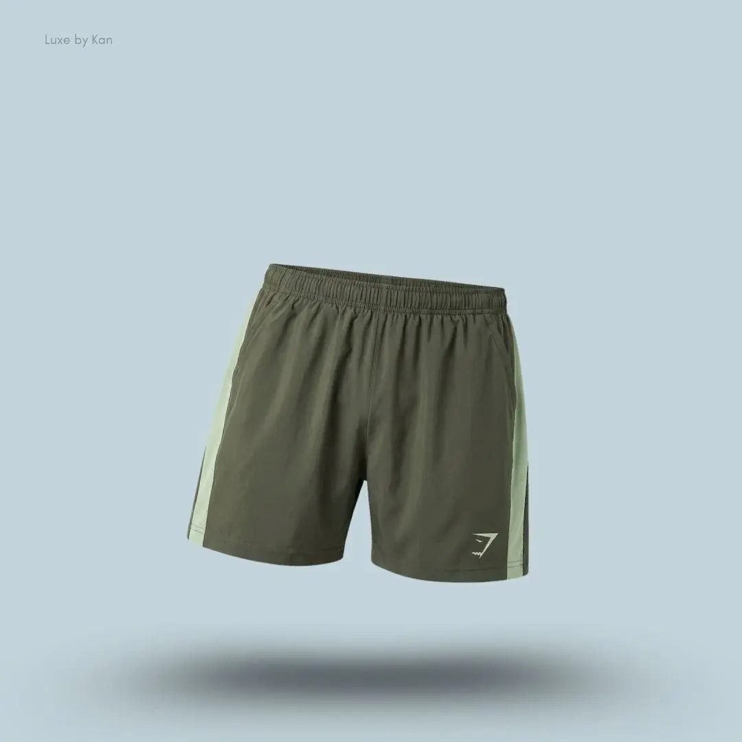 Gymshark Sport 5" Shorts men's slim-fit training shorts in olive green with contrast side panels on a blue background
