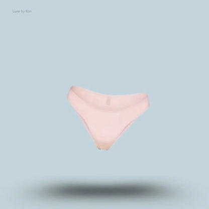 SKIMS Shine Foundations Dipped Bikini in Dusky Pink, flat lay on light blue background