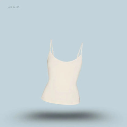 SKIMS Sleep Cami in Ecru, flat lay on light blue background