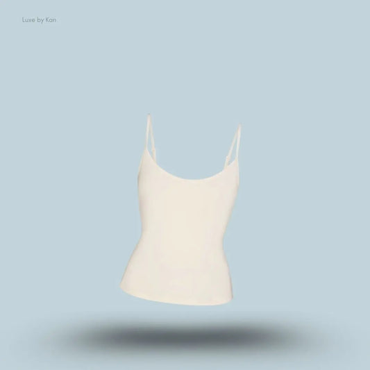 SKIMS Sleep Cami in Ecru, flat lay on light blue background