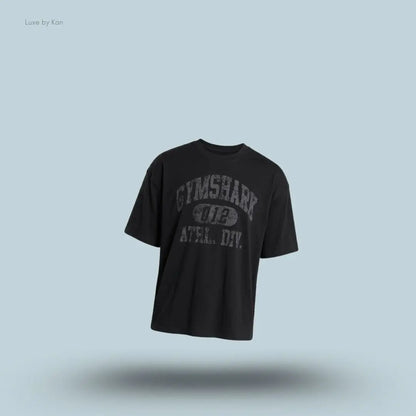Gymshark Athletic Division Graphic T-Shirt in black with front graphic print on a blue background