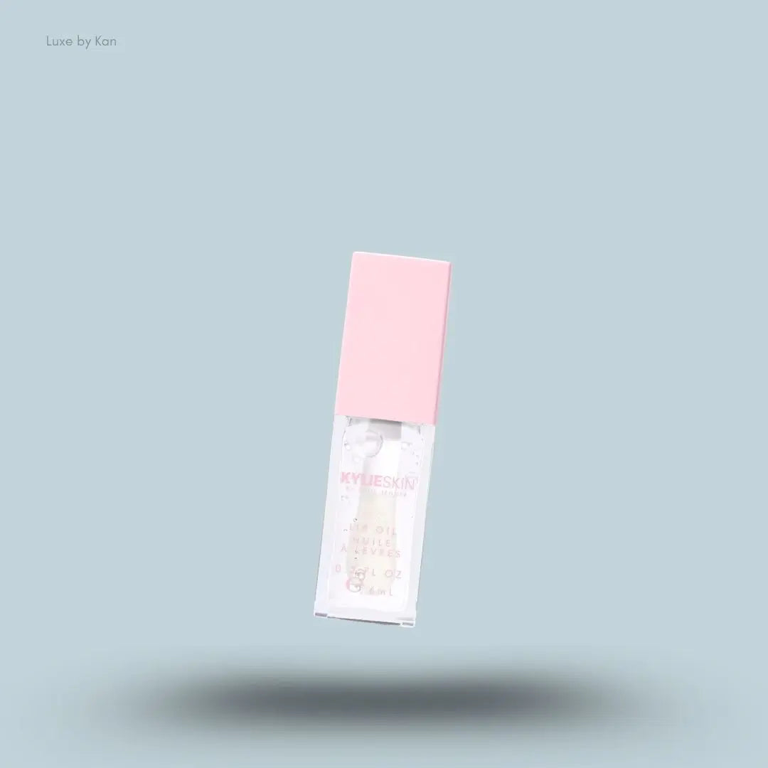 Kylie by Kylie Jenner Lip Oil bottle on blue background — Luxe by Kan India