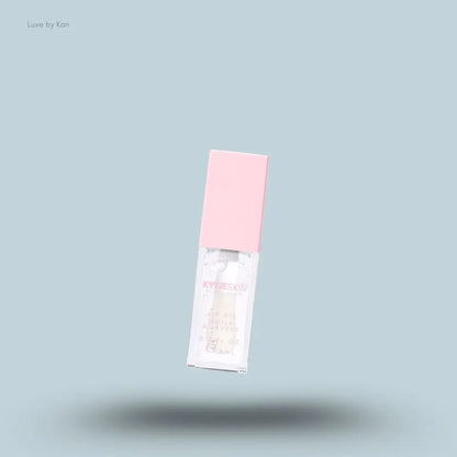 Kylie by Kylie Jenner Lip Oil bottle on blue background — Luxe by Kan India