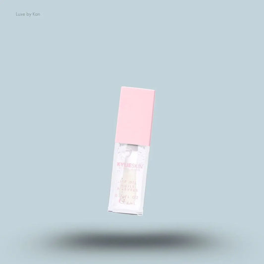 Kylie by Kylie Jenner Lip Oil bottle on blue background — Luxe by Kan India