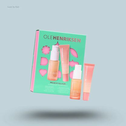 OLEHENRIKSEN Peach Glaze Plumping Duo niacinamide glow serum and peptide lip treatment with box on blue background