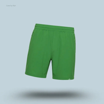 Lululemon Pace Breaker Linerless Short 7" in green, front view on light blue background