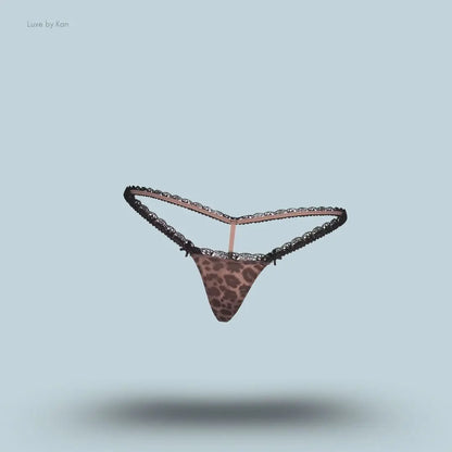 SKIMS Fits Everybody Lace Micro Thong in Limited Edition Umber Leopard Print, flat lay on light blue background