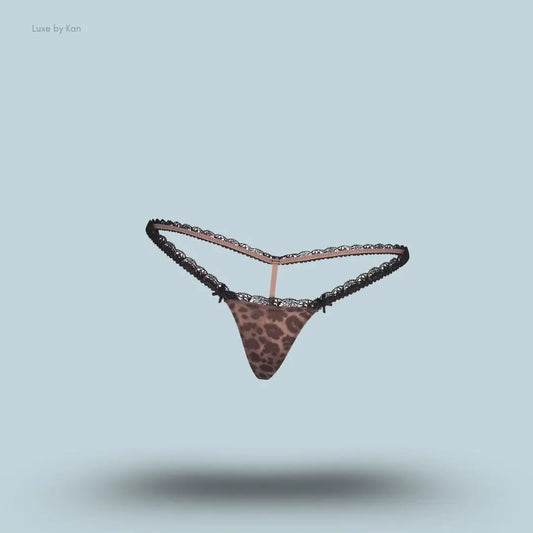 SKIMS Fits Everybody Lace Micro Thong in Limited Edition Umber Leopard Print, flat lay on light blue background