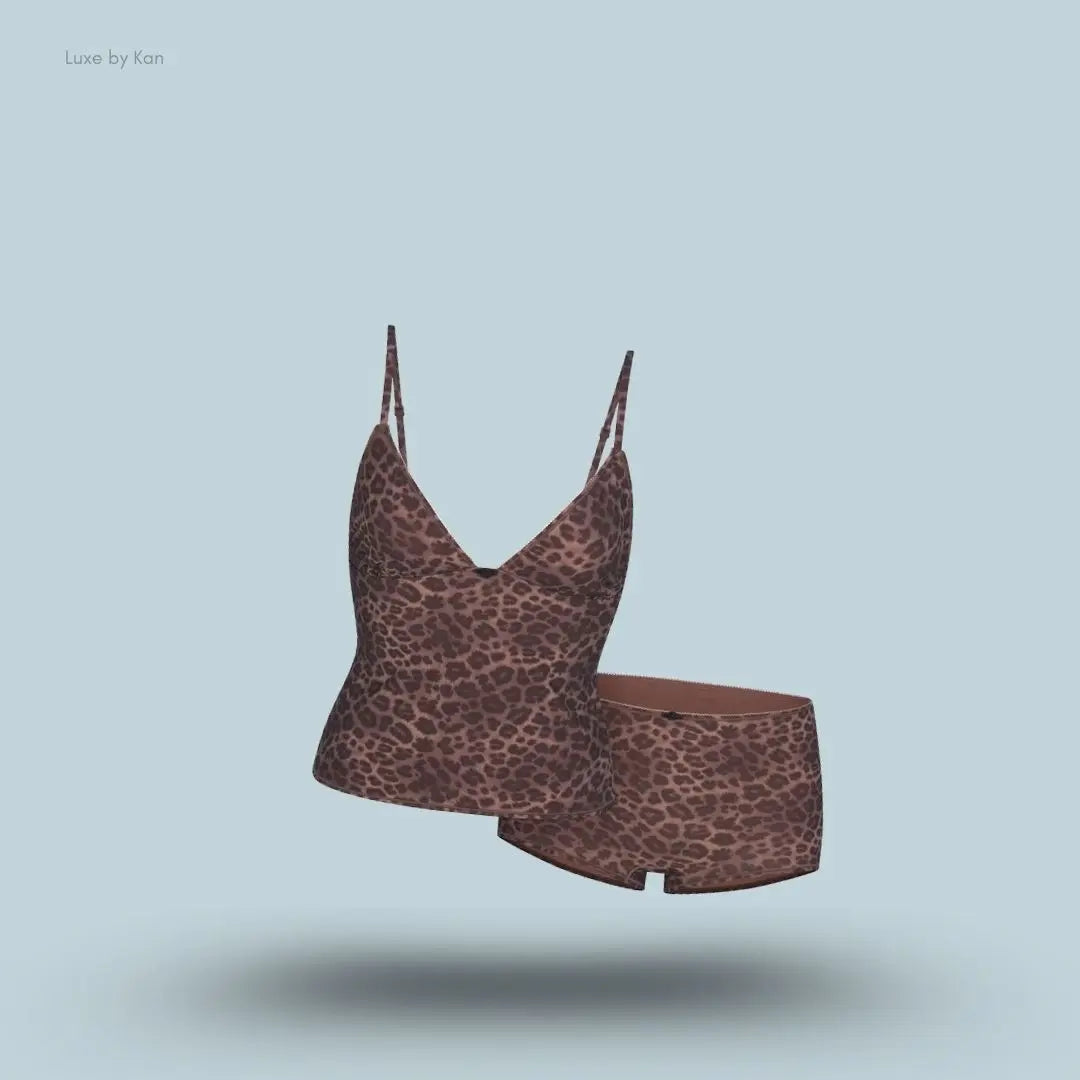 SKIMS Fits Everybody Picot Cami and Boy Short Set in Limited Edition Umber Leopard Print, flat lay on light blue background