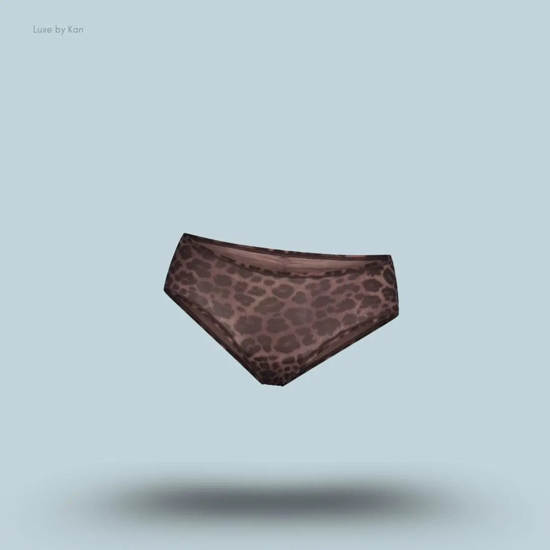 SKIMS Fits Everybody Micro Hipster in Umber Leopard Print, flat lay on light blue background