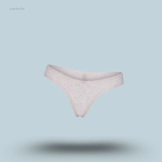 SKIMS Lightweight Cotton Lace Thong in Light Heather Grey, flat lay on light blue background
