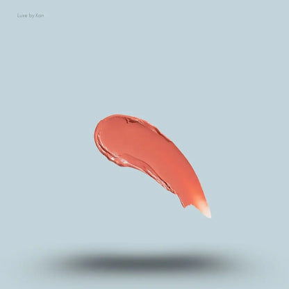 Kylie Cosmetics Tinted Butter Balm swatch on blue background — Luxe by Kan India