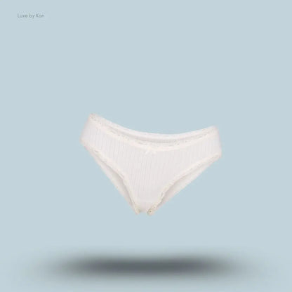 SKIMS Lightweight Cotton Pointelle Lace Brief in Marble Tonal, flat lay on light blue background