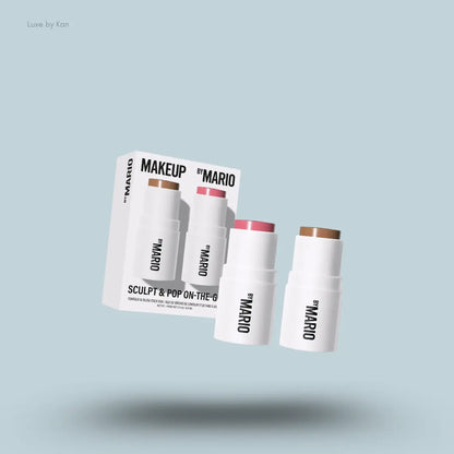 Makeup By Mario Sculpt & Pop On The Go Duo shaping stick and blush stick with packaging on blue background