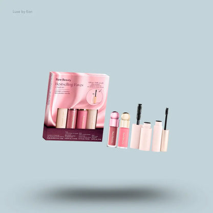 Rare Beauty Bestselling Faves 4-Piece Set liquid blush, lip gloss, brow gel and mascara with box on blue background