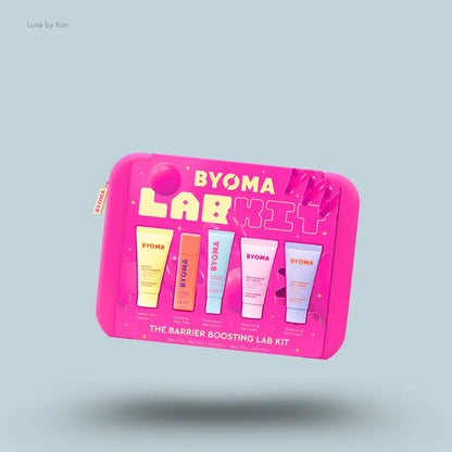 BYOMA The Barrier Boosting Lab Kit five skincare products with packaging on a blue background
