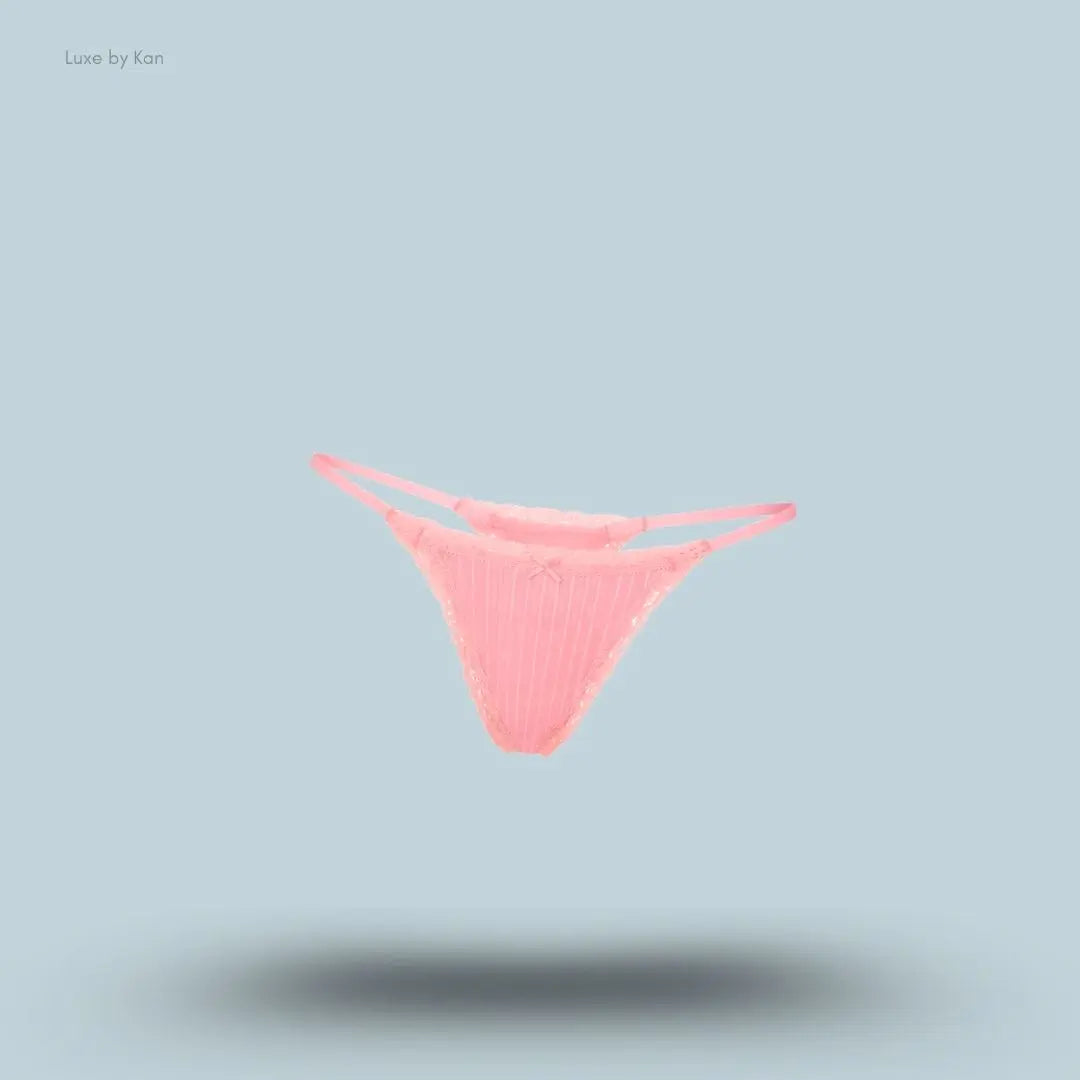 SKIMS Lightweight Cotton Pointelle Lace String Thong in Melon Tonal, flat lay on light blue background