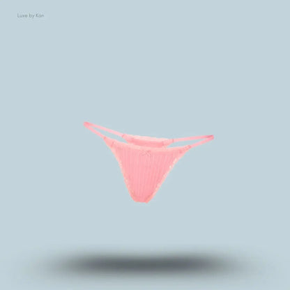 SKIMS Lightweight Cotton Pointelle Lace String Thong in Melon Tonal, flat lay on light blue background