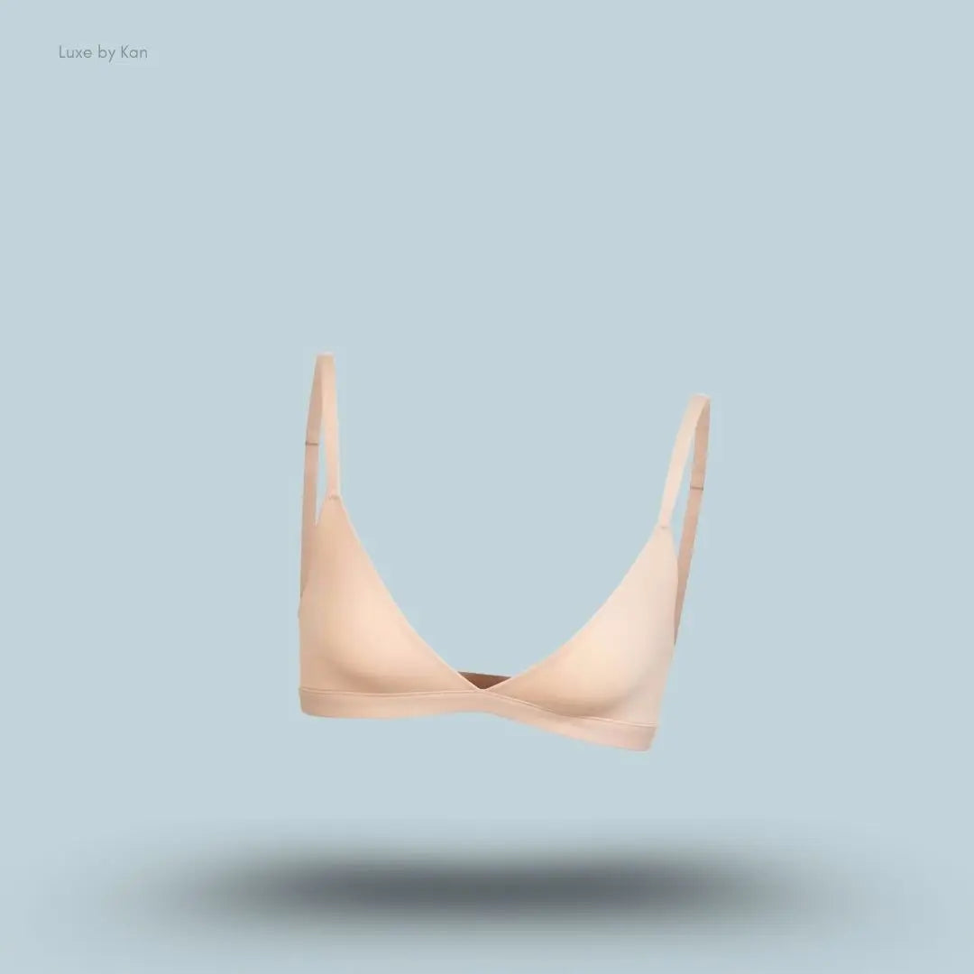 Skims Fits Everybody Triangle Bralette in nude, front view on a light blue background with a floating product display.