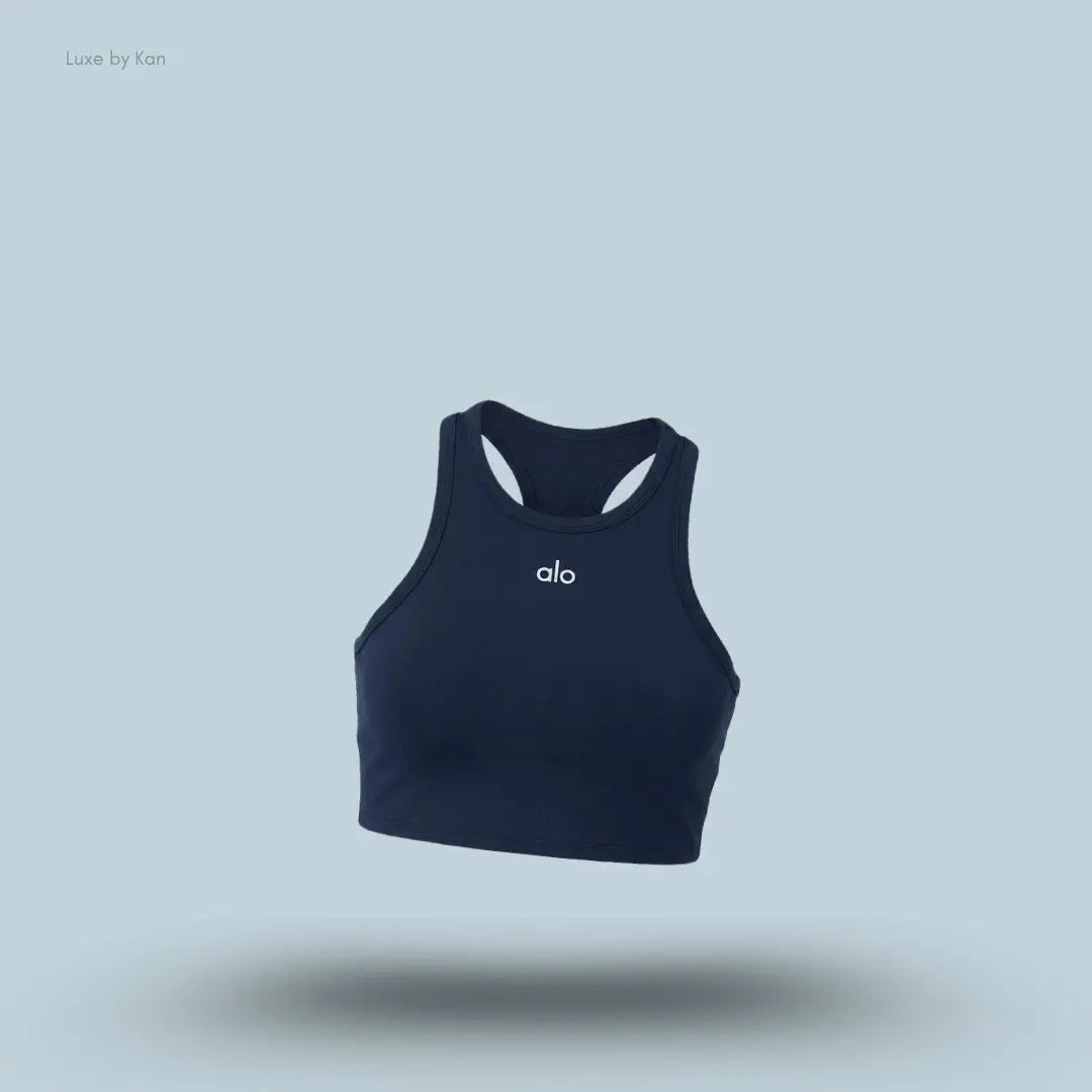 Alo Aspire Tank in Navy/White, flat lay on light blue background