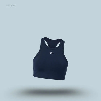 Alo Aspire Tank in Navy/White, flat lay on light blue background