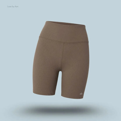 Alo 5 inch Seamless Ribbed Favorite Short in Olive Tree, flat lay on light blue background