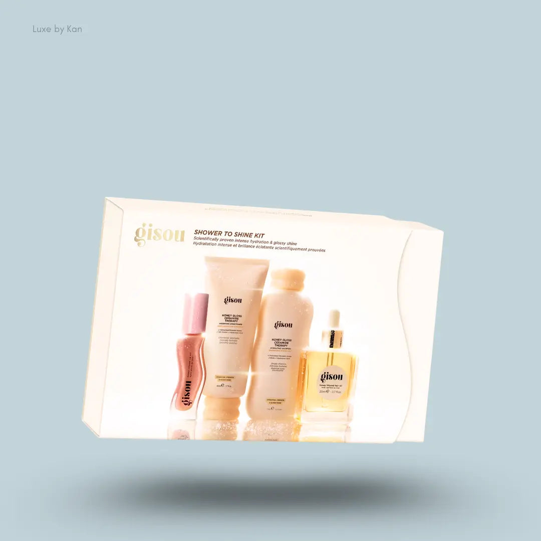 Gisou Shower to Shine Kit with honey shampoo, conditioner, hair oil, lip oil inside the box