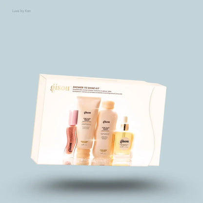 Gisou Shower to Shine Kit with honey shampoo, conditioner, hair oil, lip oil inside the box