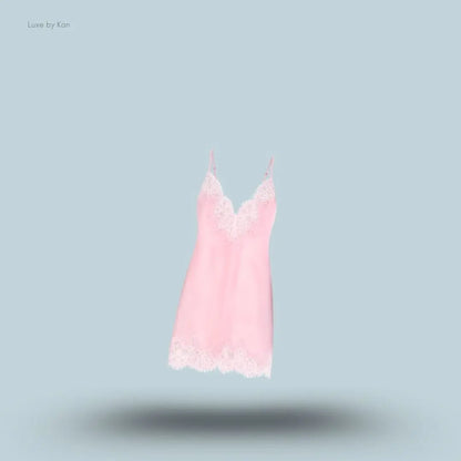 SKIMS Silk Lace Mini Slip Dress in Limited Edition Peony Tonal, flat lay on light blue background