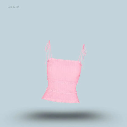 SKIMS Sheer Knit Ruffle Cami in Peony, flat lay on light blue background