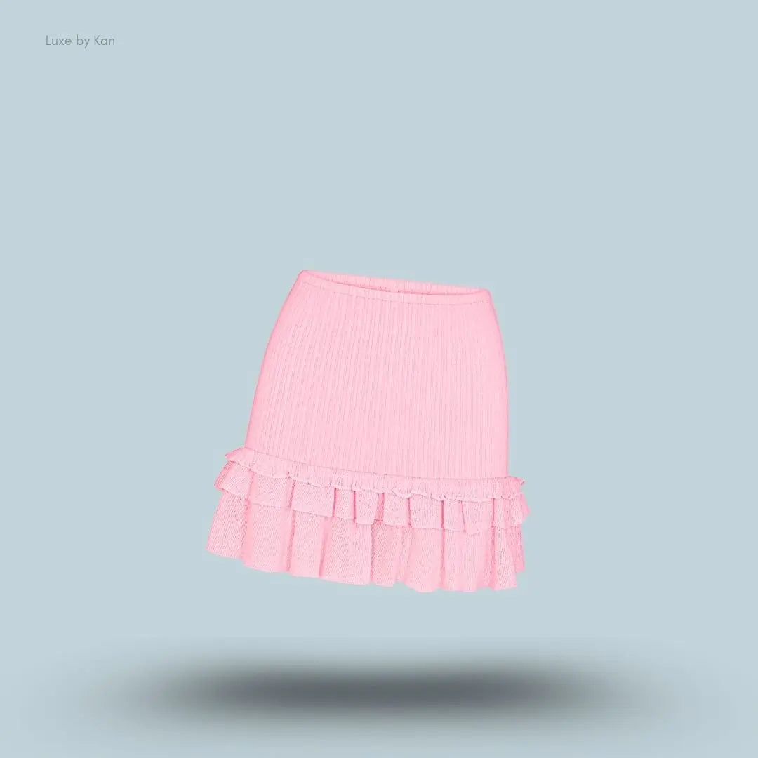 SKIMS Sheer Knit Ruffle Mini Skirt in Peony, flat lay on light blue background
