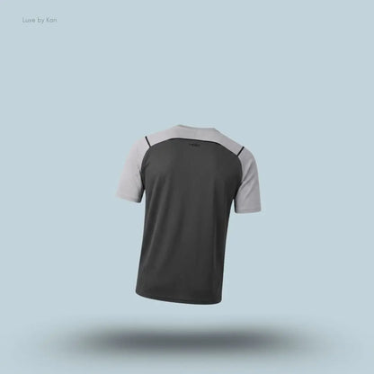 Gymshark Arrival Contrast T-Shirt in light grey displayed on a blue background with contrast shoulder piping and short sleeves back view