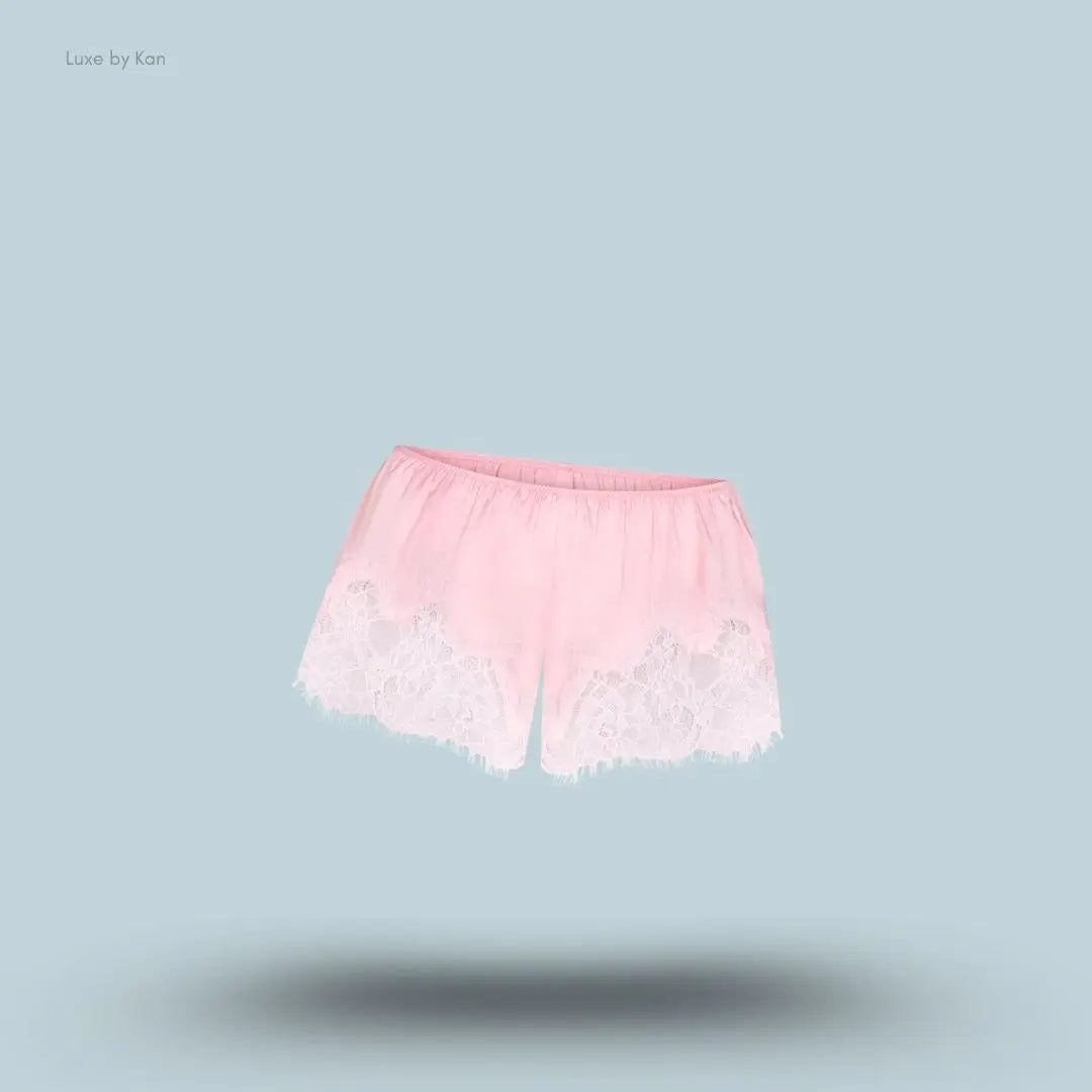 SKIMS Silk Lace Short in Limited Edition Peony Tonal, flat lay on light blue background