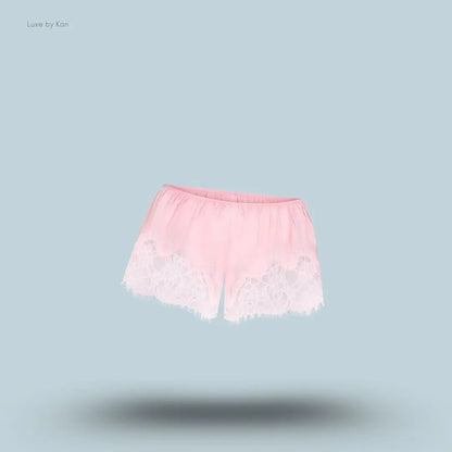 SKIMS Silk Lace Short in Limited Edition Peony Tonal, flat lay on light blue background