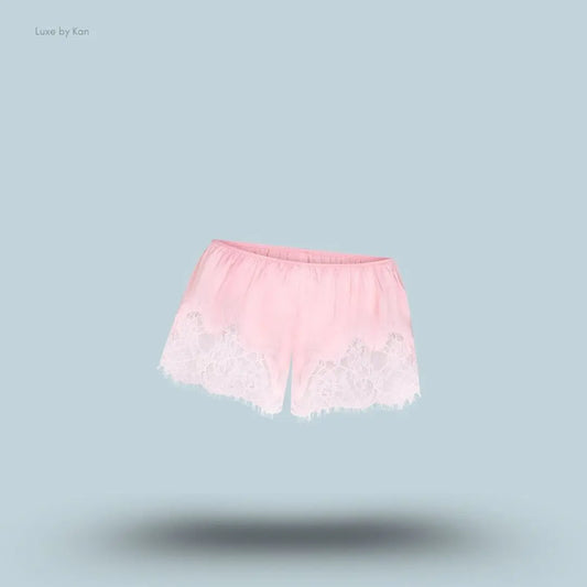 SKIMS Silk Lace Short in Limited Edition Peony Tonal, flat lay on light blue background