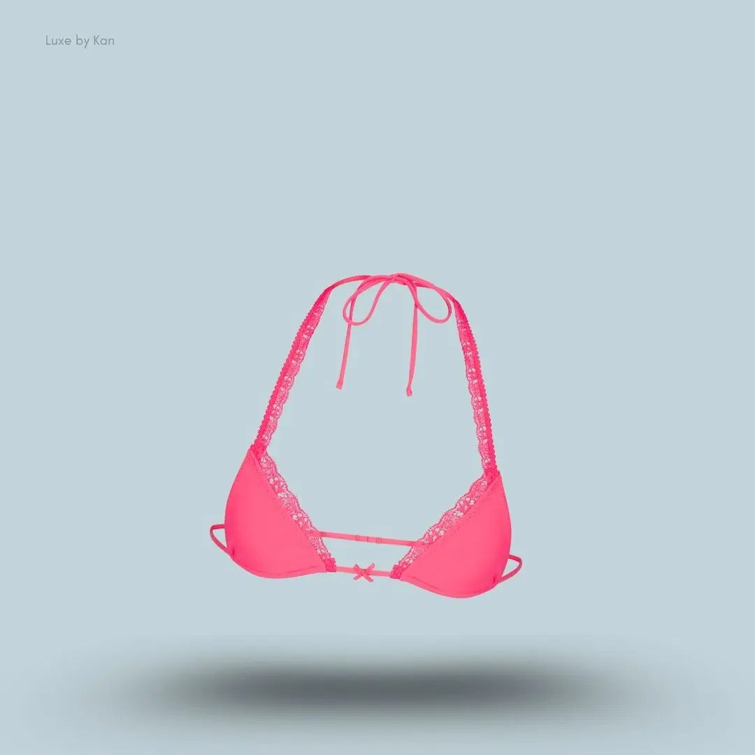 SKIMS Fits Everybody Lace Micro Bralette in Ultra Pink, flat lay on light blue background