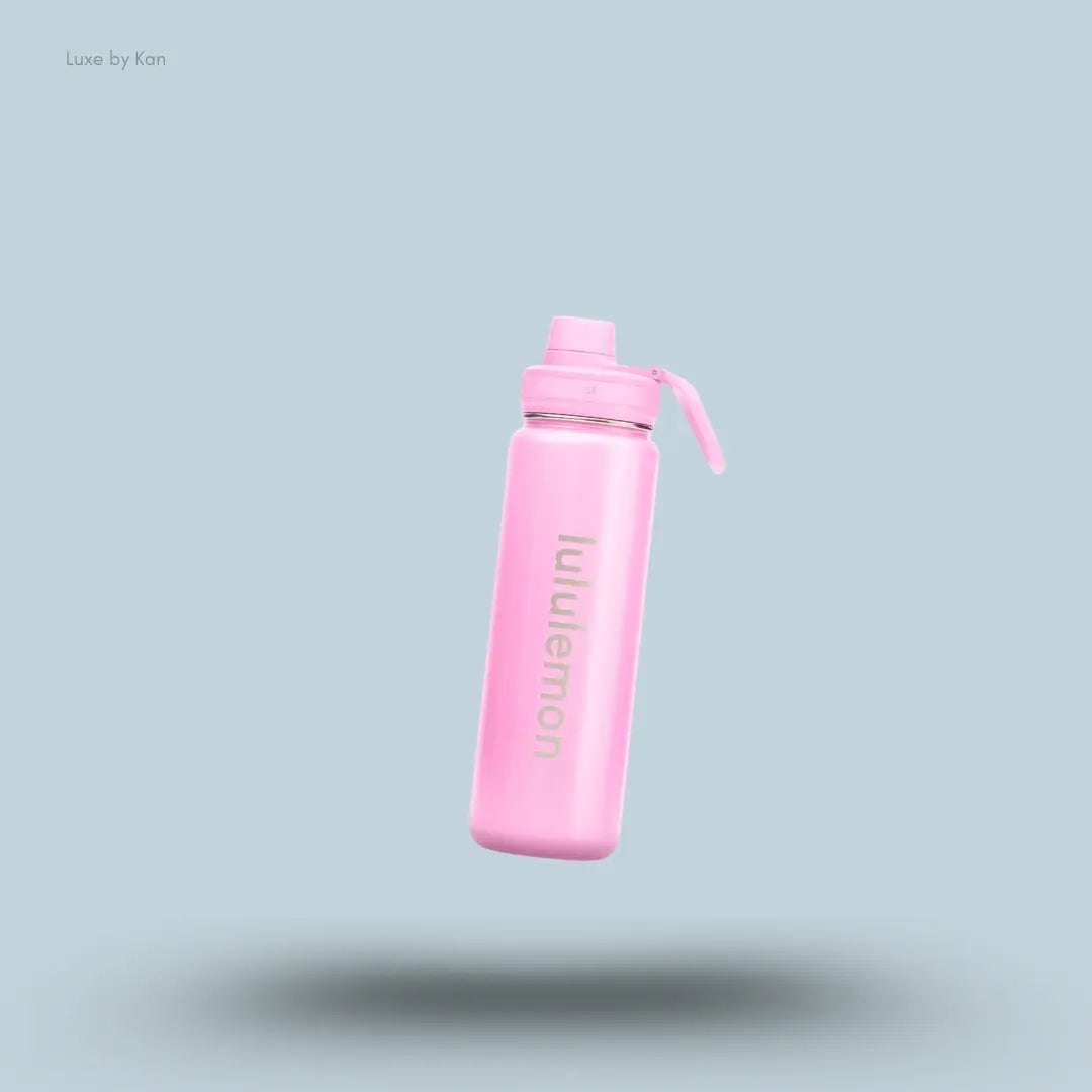 Lululemon Back to Life Sport Bottle 24oz Shine in Pink Pearl, on light blue background