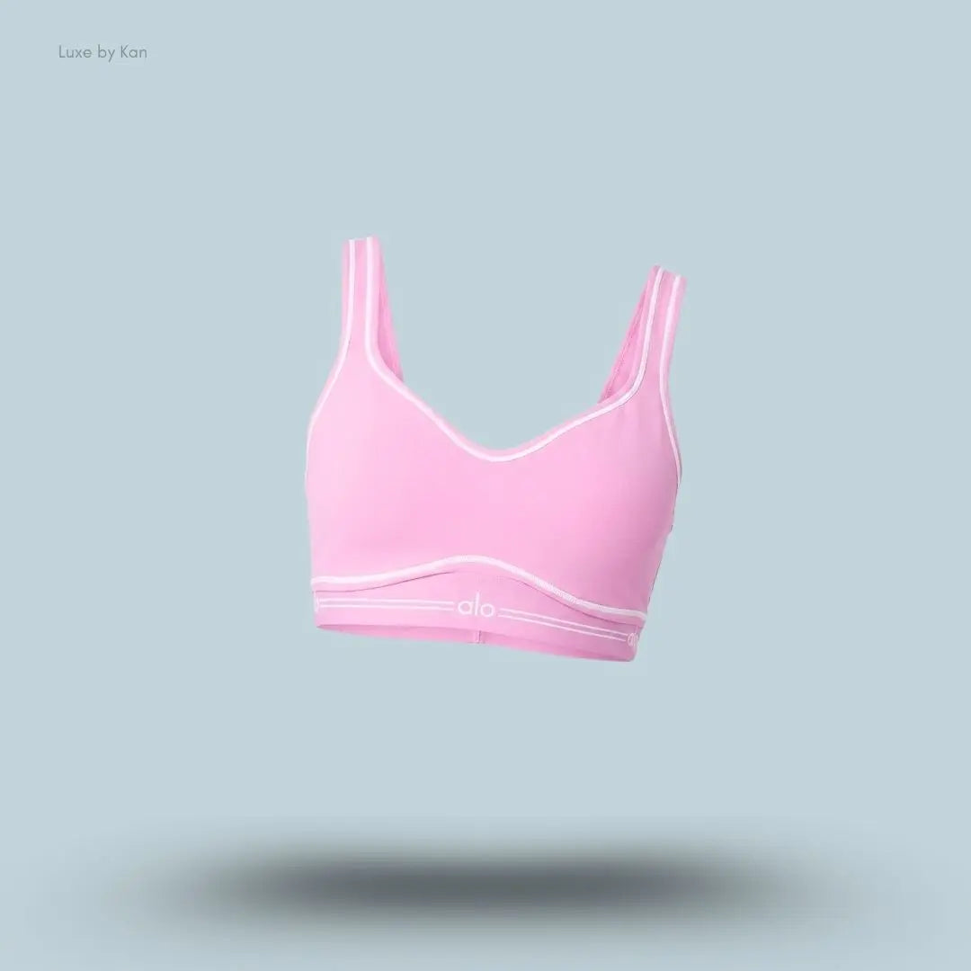 Alo Airbrush Heart Throb Bra in Candy Heart Pink/White, flat lay on light blue background